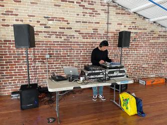 Lab manager Jeff Sacramento serving as the party's DJ