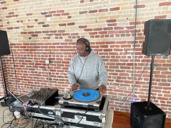 Lab member Cleopa Omondi taking a turn as the party's DJ