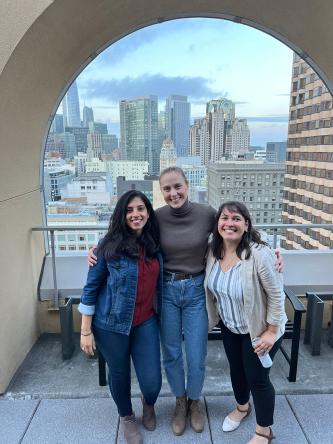 Ferguson lab members pose for a photo with the SF skyline visible behind them.